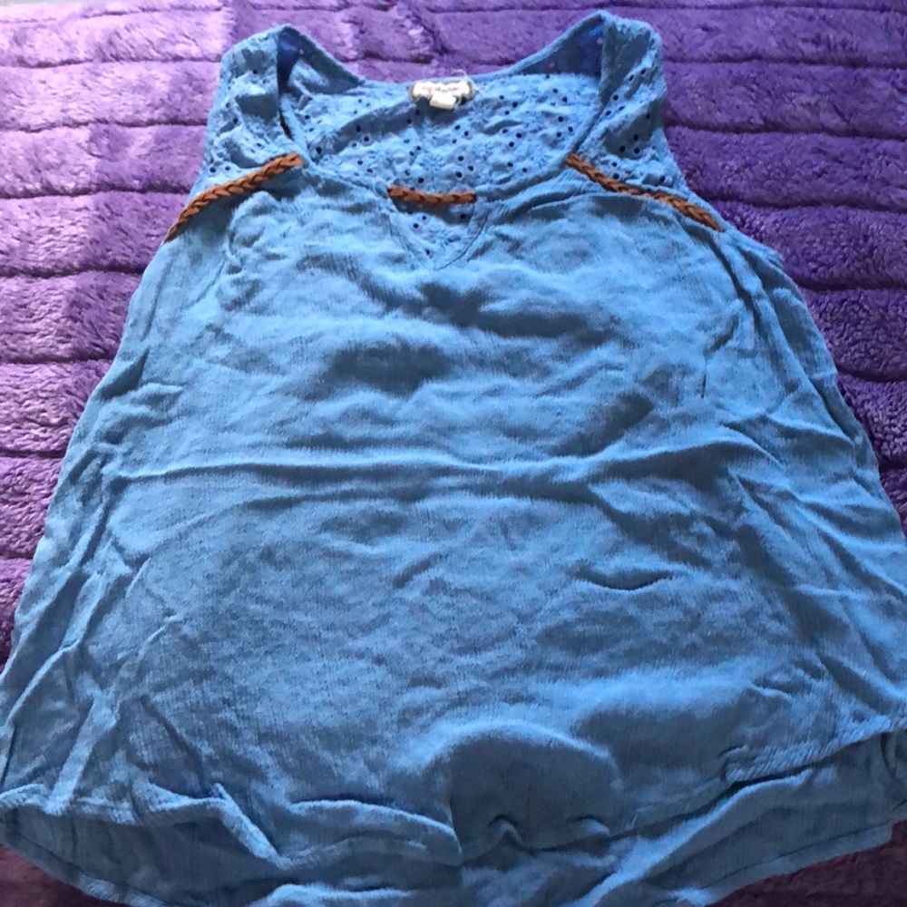 light blue crop top with a brown rope on the neck